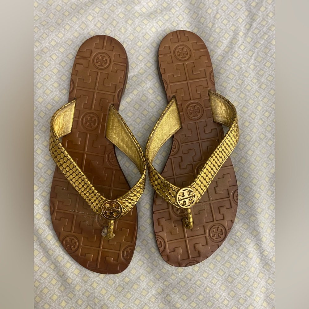 Tory Burch flip flops gold. Loved